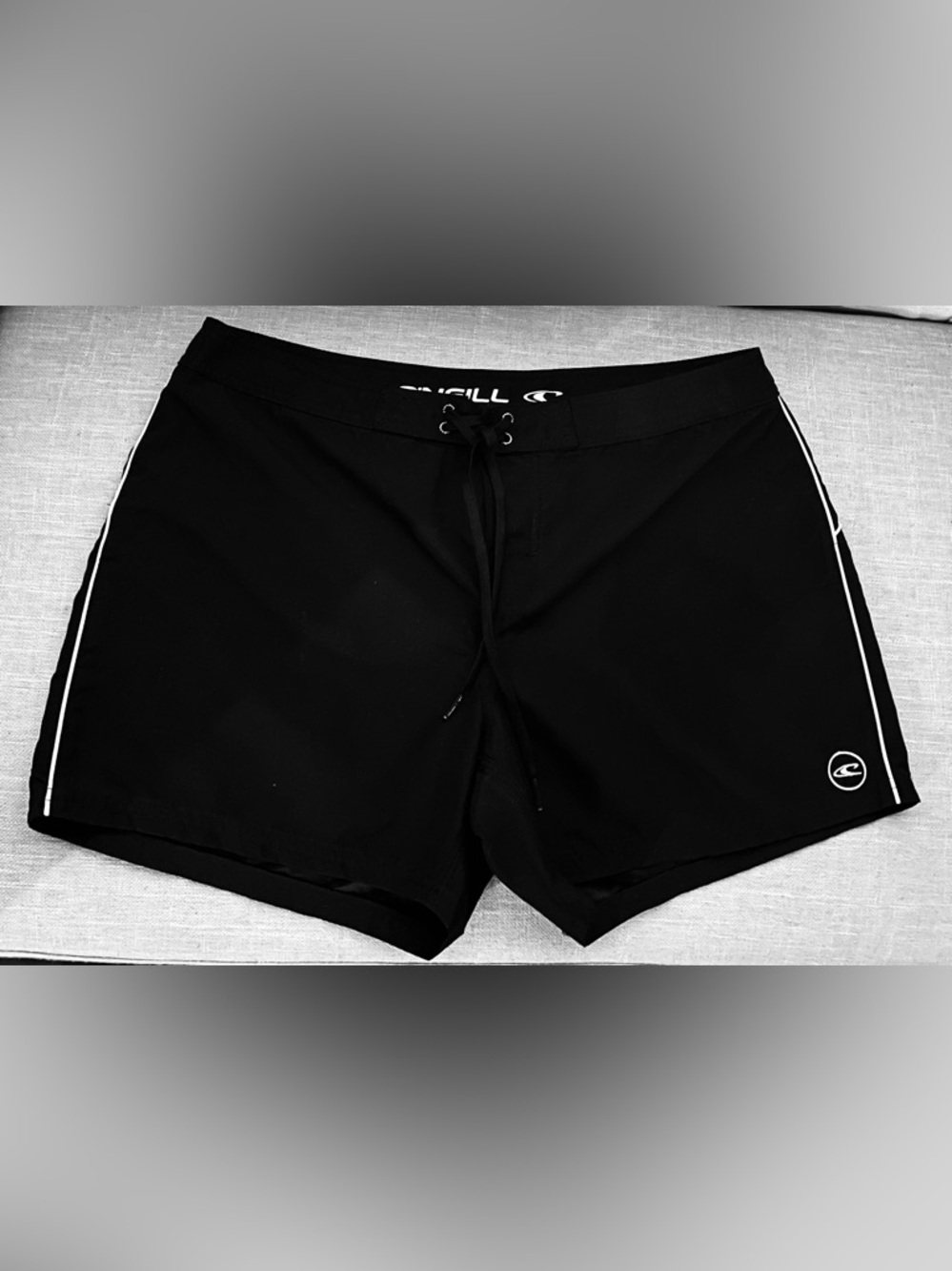 O'Neill Black Women’s Shorts with White Side Stripe and one back packet